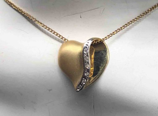 14 KT Brushed Yellow Gold Heart With A Wave Of Diamonds