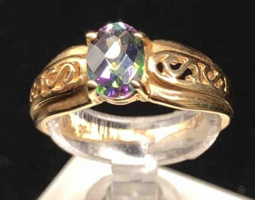 14 KT Yellow Gold Small Oval With Design On Band Caribbean Topaz