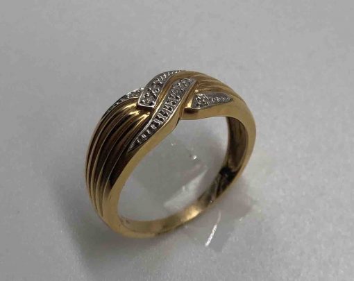 gold band with design and diamonds ring