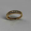 simple shiny band with 12 invisibly set diamonds