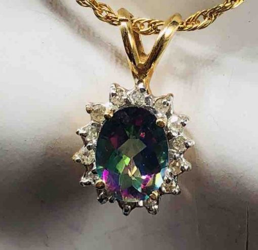 Small Oval Checker Board Caribbean Topaz Surrounded By Diamonds